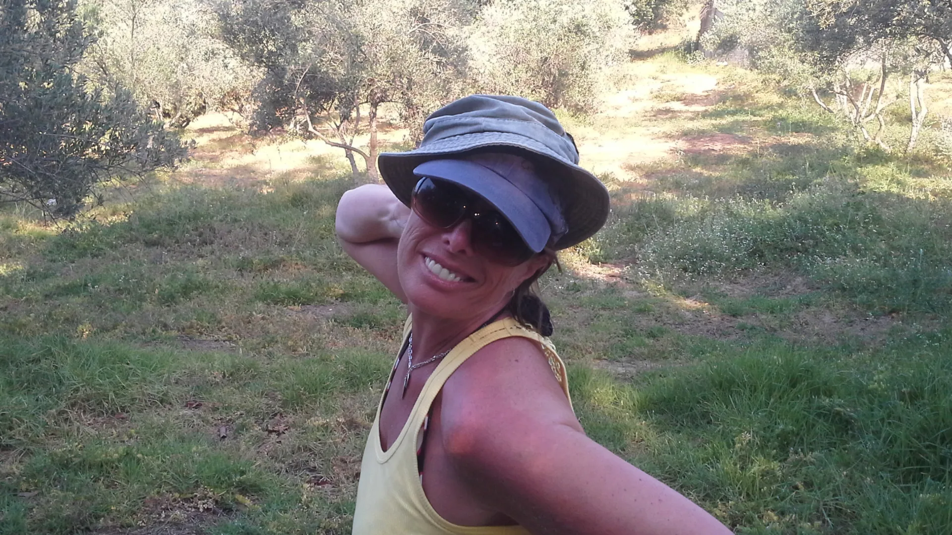 “Jane, blending into the Cretan wilds - sunshine, scrubland, and just enough hats to confuse the local wildlife.”