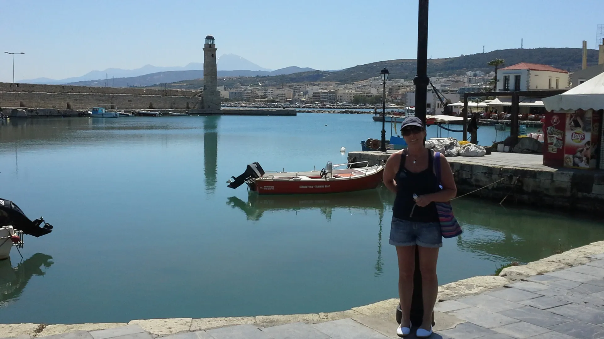 “Evening calm at Rethymno’s Venetian Harbour - boats resting, the old lighthouse standing watch, and Crete at its most peaceful.”